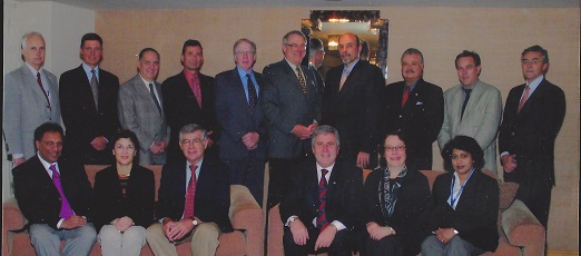 Dr. Simons with Board members
